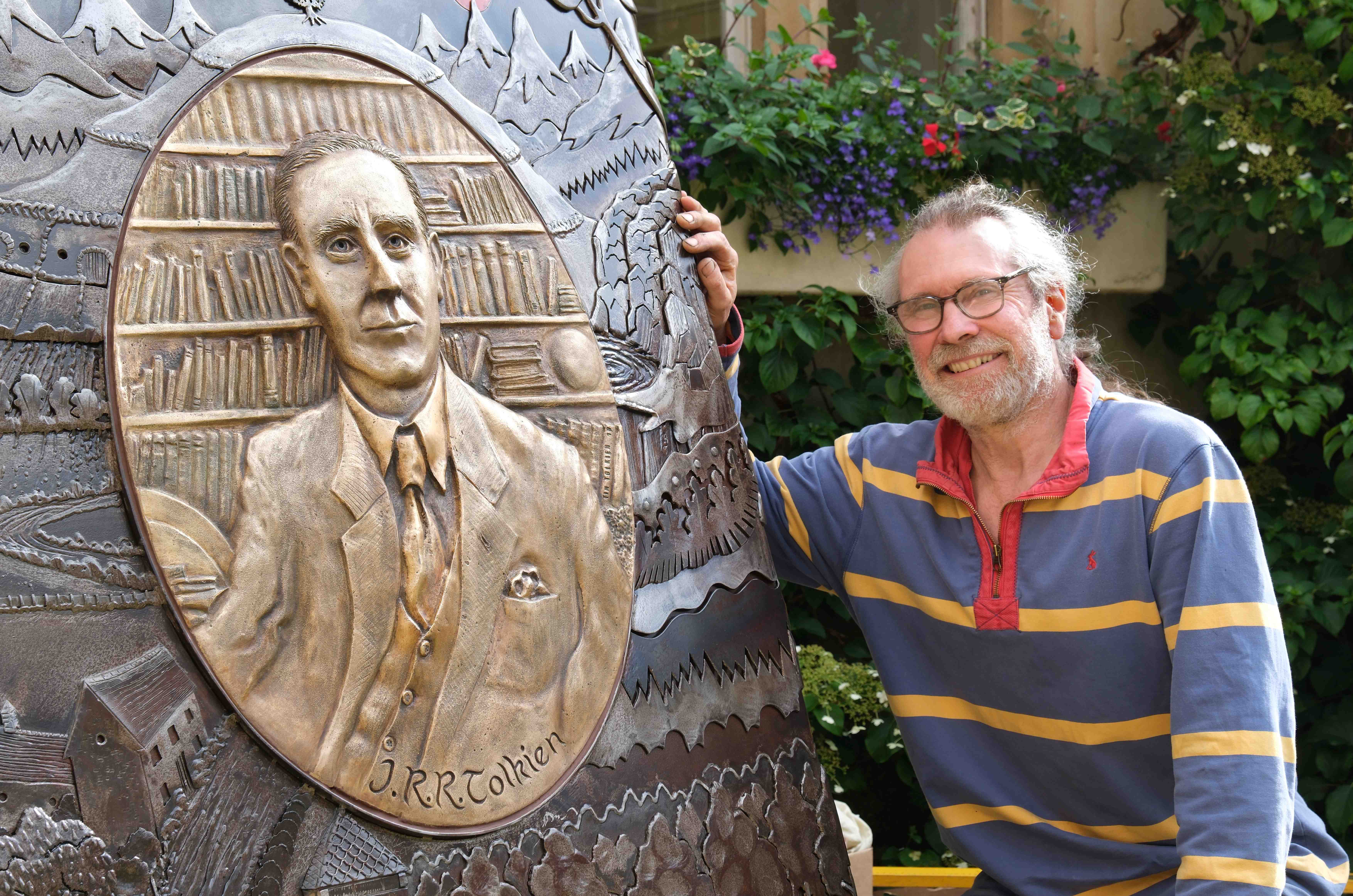 Side angle of Tolkien memorial, with Tim Tolkien (sculptor)